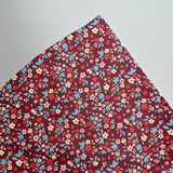 Beschichtete Baumwolle Bordeaux mit Blümchen 0,5m