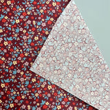 Beschichtete Baumwolle Bordeaux mit Blümchen 0,5m