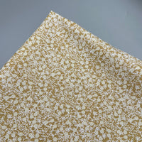 Baumwollpopeline Gelb mit weißen Streublumen 0,5m